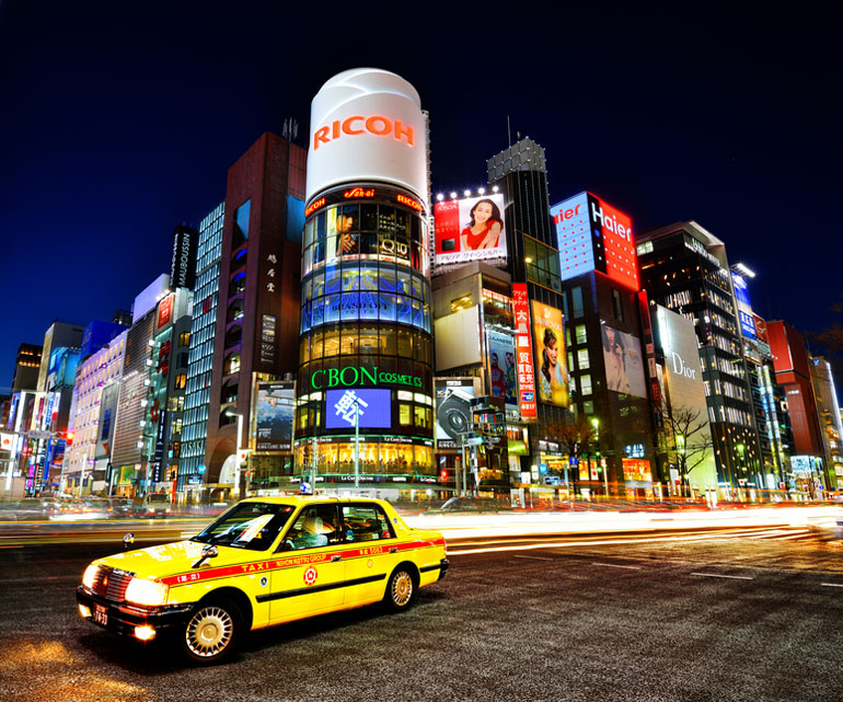 Taxi and buildings in Tokyo, Japan